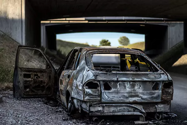 Scene of a car burnt after an accident.
